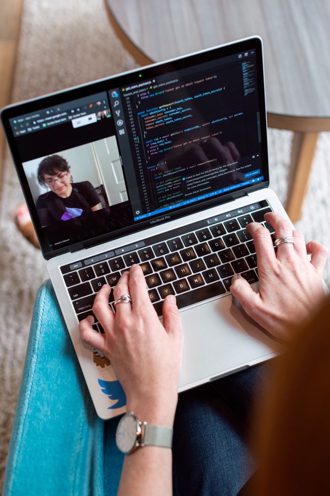 Learner working on a laptop during a live video lesson